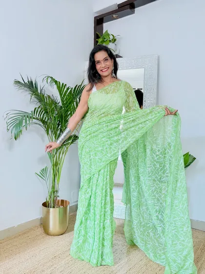 A light green Chikankari saree that is perfect for a subtle and graceful look. The delicate handwork makes it a very special piece.