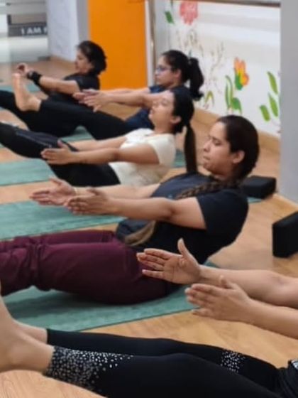 The boat pose, or Navasana, is a core-strengthening powerhouse. Our clients hold the pose with determination, building a strong and stable center.