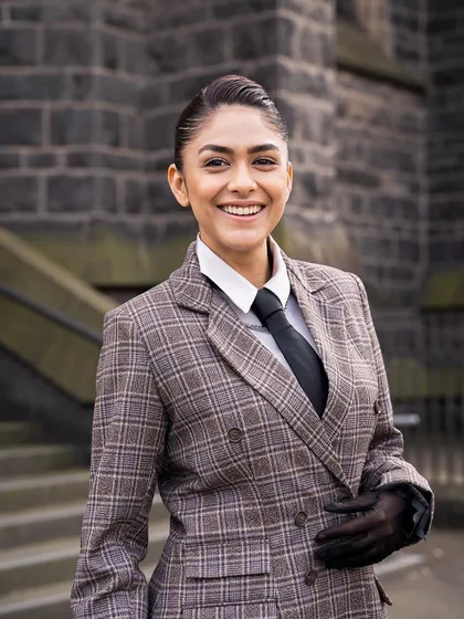 This custom androgynous plaid suit from Label Manikananda is incredibly sharp. The double-breasted jacket, tie, and gloves create a powerful, high-fashion look.