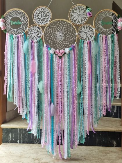 Catch whispers of serenity with our pastel floral dreamcatcher. The soft hues and delicate blooms intertwine to create a haven of peaceful dreams.