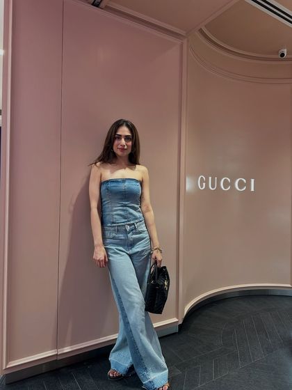 Another pose in the all-denim outfit. The structured corset top contrasts nicely with the relaxed fit of the jeans.