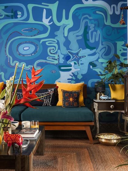 A glimpse into our home studio, a space for playfulness and wild, raw, creative energy. The deep blue mural reflects our love for the open water.