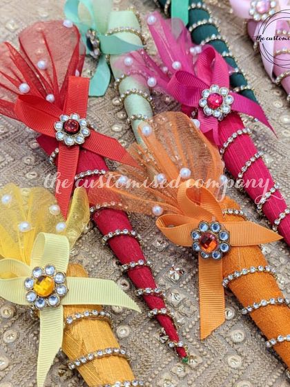 Elegant and affordable trousseau packing. These decorated cones are perfect for presenting shagun or small gifts during mehendi ceremonies, adding a touch of color and sparkle.