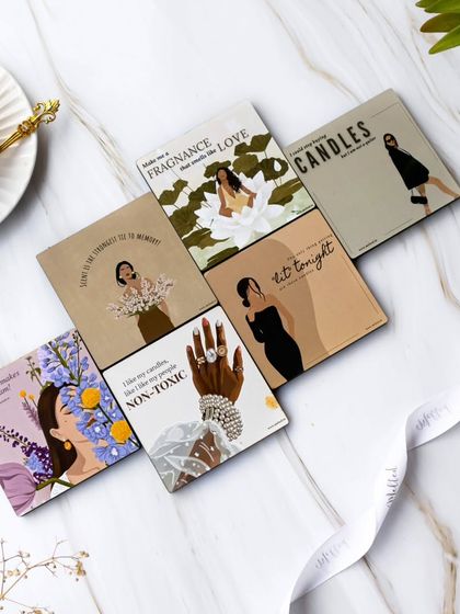 Each illustrated card in this flatlay tells its own story. I styled them with a cup of tea and a soft ribbon on a marble background to create a look that is both aspirational and personal.