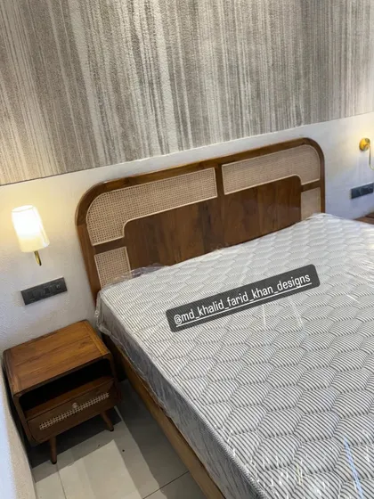 Another angle of the hotel bed and nightstand.