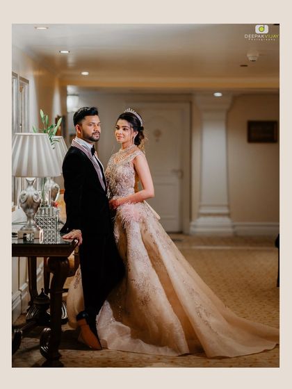 This intimate portrait captures a gentle moment between the couple. The soft lighting of the hotel corridor and their elegant attire combine to create a feeling of timeless romance.