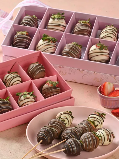 Berry sweet indulgence. These are our beautiful chocolate-dipped strawberries, available on skewers or in elegant gift boxes.