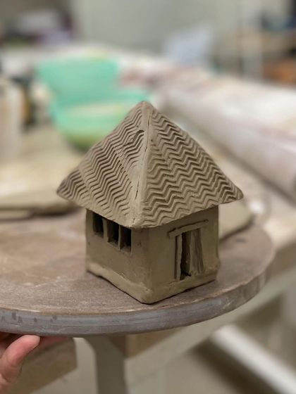 How charming is this little clay house? Our hand-building workshops let you explore your imagination and create whimsical sculptures.