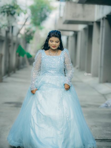 Feel like you're in a fairytale with this stunning blue princess gown. It's perfect for making a grand entrance at any event.