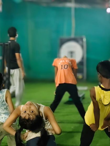 Fun and games are part of the process. Here, the kids enjoy a moment of playfulness while still working on their balance and body awareness.