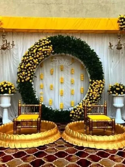 I love creating vibrant and grand setups for Haldi ceremonies. This design uses a massive ring of marigolds and lush greens to create a spectacular focal point for your celebration.