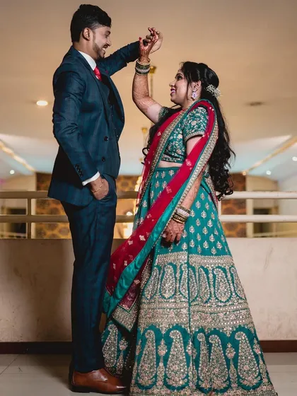 For a reception, we can create a more glamorous and contemporary look. Here, I styled the bride with a sophisticated updo and bolder makeup to complement her ornate lehenga, ensuring she looked stunning for her evening celebration with her partner.