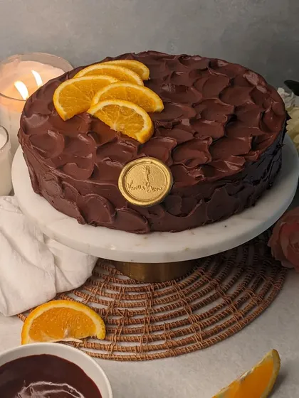 A bright twist on a classic. Our Orange Belgian Dark Chocolate cake features homemade Malta Orange Marmalade layered with our signature dark chocolate ganache.