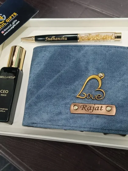 A thoughtful gift set combining a personalized denim wallet with a name-engraved pen and a bottle of Bella Vita CEO perfume.
