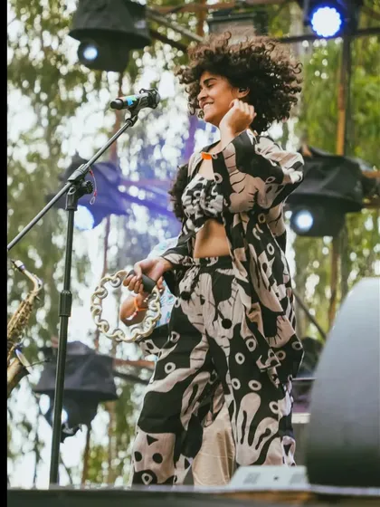 Modeling a stunning co-ord set from The Jodi Life during a live performance with my band. This shows how I can naturally showcase fashion in a high energy, authentic environment, connecting the brand with a live audience.