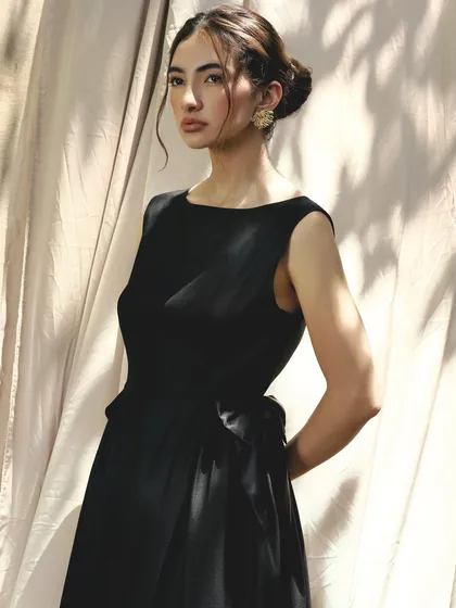 A duplicate of image 11, showing the classic and timeless look with a soft updo and defined eyes.