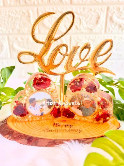 Turning old into gold! This photo shows how I upcycled old t-light holders into a stunning "Love" photo frame, perfect for an anniversary gift.