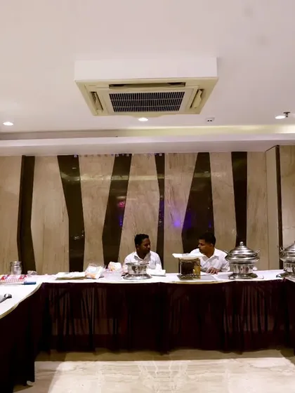 As an all-in-one event partner, we can manage catering for your corporate functions. This buffet setup shows a professional arrangement with chafing dishes, ensuring a seamless experience for your guests.