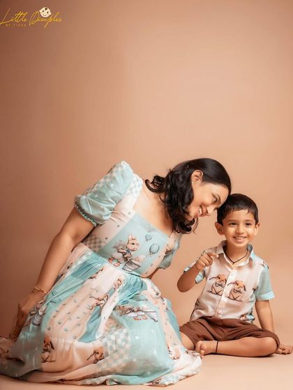 A tender moment shared between a mother and her younger son during their studio session.