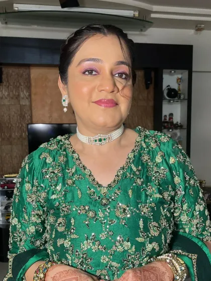 A close-up of the makeup, showing the shimmery eyeshadow and the perfectly matched lip color.