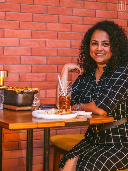 A guest enjoying the food and ambiance at her table.