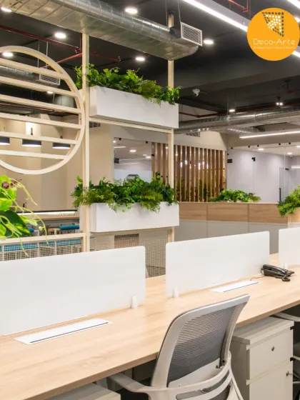 We blend biophilic design with functionality to create workspaces that breathe. The integrated planters at Brandman not only add life to the space but also serve as natural partitions in the open office.