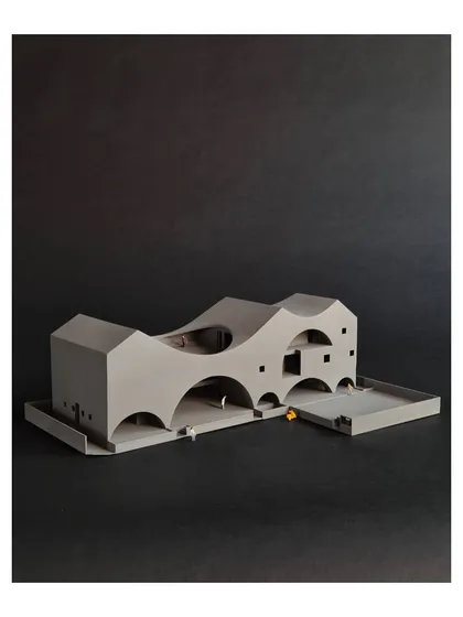 This 3D-printed model of "The Arcades Project" demonstrates our process of reinterpreting familiar forms like arches and pitched roofs. The design for this community center uses these elements to create a porous, light-filled volume that engages with its neighborhood.