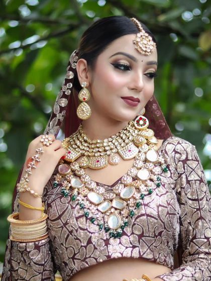 A bride wearing a heavy, oversized Polki necklace set with a unique printed lehenga. This shows how my jewellery can be paired with both traditional and contemporary outfits.