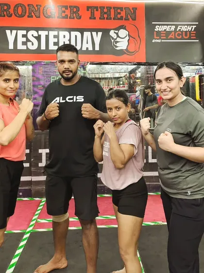 Posing with some of my female fighters. They bring incredible energy and dedication to every single session.