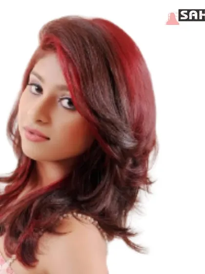 A professional shot showcasing a bold red fashion color with layers and styling.