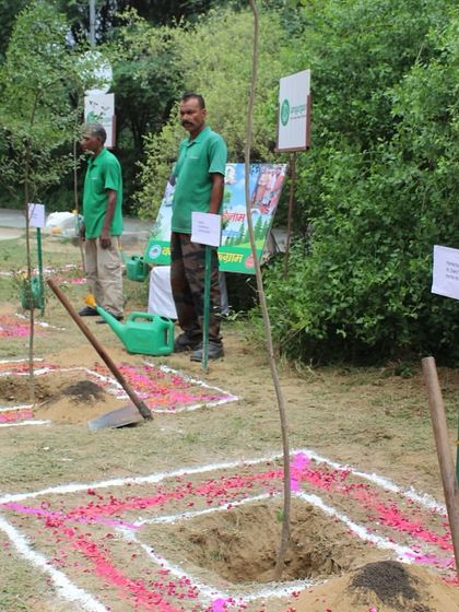Pits are prepared and decorated with rangoli for a ceremonial planting event at the Badshahpur Forest Corridor, ready for our honored guests to plant native trees.