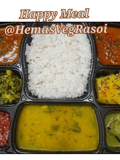 A complete meal platter featuring soft rawa dhokla with chutney, dal, rice, masoor gravy, turia dry, and a fresh tomato salad.