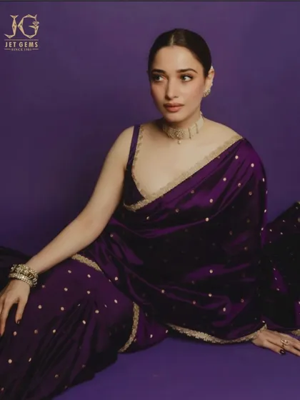 A portrait of serenity and beauty. Tamannaah Bhatia, in a deep purple sari, exudes elegance while wearing my delicate diamond choker and traditional Polki bracelets.