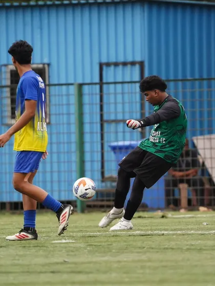 Our goalkeeper confidently plays the ball out from the back, initiating an attack as part of our build-up play.