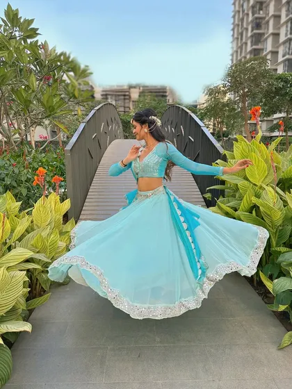 A series of photos capturing the twirls and graceful movements of semi-classical dance. The flow of the lehenga is essential to the visual beauty of this style.