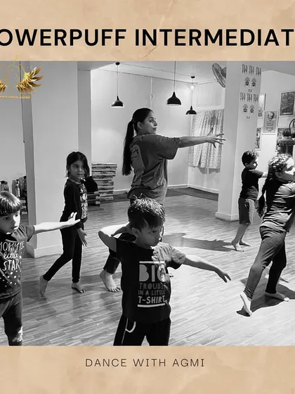 A black and white shot of our Powerpuff Intermediate class. The focus is on clean lines and arm positions, fundamental aspects of their training.
