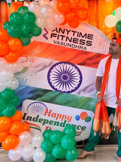 Posing with the tricolor decorations at our Independence Day celebration. The setup adds so much to the festive and patriotic vibe.
