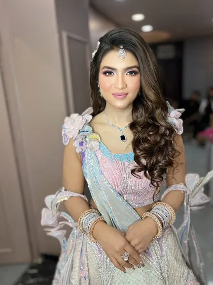 The makeup is soft and pretty, letting the colorful outfit be the main focus.