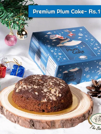 A closer look at our premium plum cake, topped with sliced almonds for extra crunch and flavor. It comes in a beautiful snowflake-themed box.