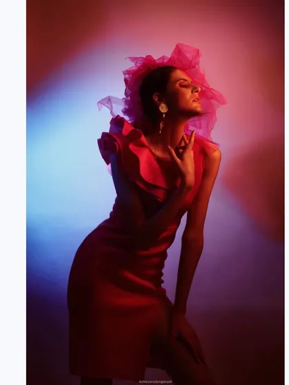 For this high-concept "Badass Barbie" editorial, I used dramatic lighting and a bold pink color palette. The styling involved a structured ruffle dress and a tulle headpiece to create a look that is both playful and powerfully high-fashion.