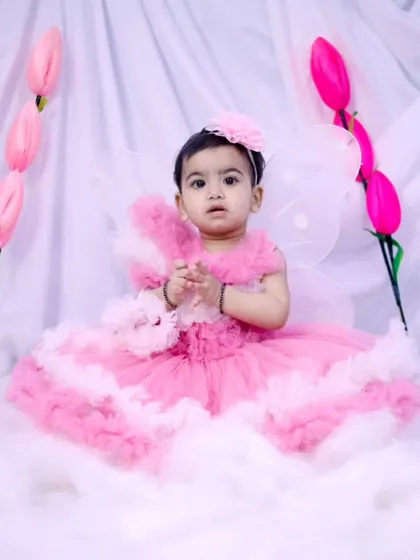 A sweet and serene portrait of a baby girl in her pink fairy costume.