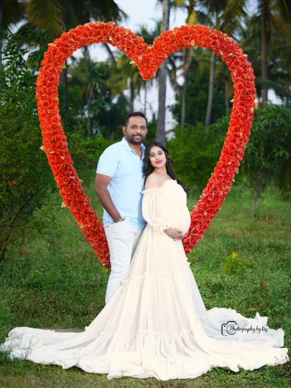 A beautiful couple's portrait framed by our red floral heart prop. The flowing white gown provides a lovely contrast.