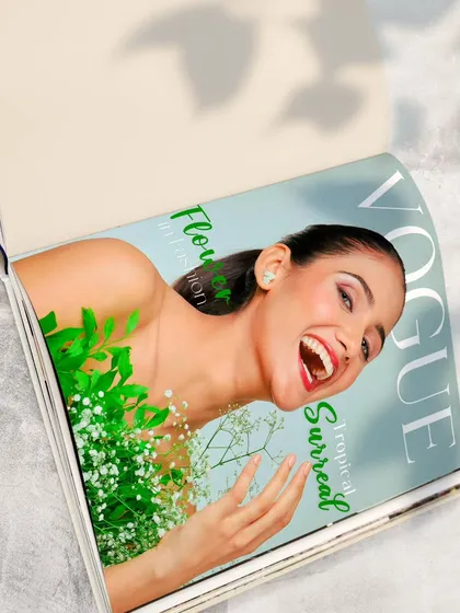 A creative edit showing the final 'Vogue' cover within a magazine. This demonstrates how the final image translates into a real-world, professional context.