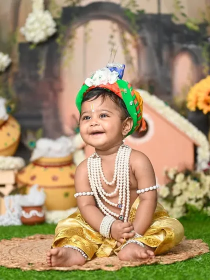 The smile on this little Krishna's face is pure joy. Capturing these happy moments is the best part of my job.