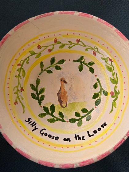 "Silly Goose on the Loose." This hand-painted bowl showcases the whimsical and personal stories you can tell through pottery painting.