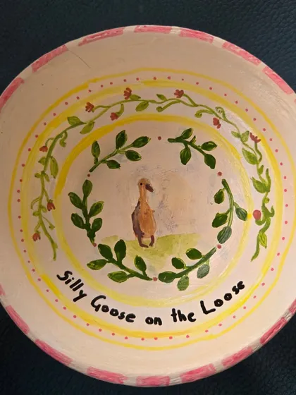 "Silly Goose on the Loose." This hand-painted bowl showcases the whimsical and personal stories you can tell through pottery painting.
