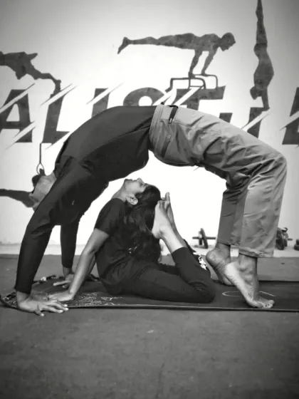 This is what trust, strength, and flexibility look like. We practice partner yoga to help you push past your limits safely, building deeper stretches and an even stronger bond with the CaliGang community. This pose combines a deep backbend (Urdhva Dhanurasana) with a supportive base.