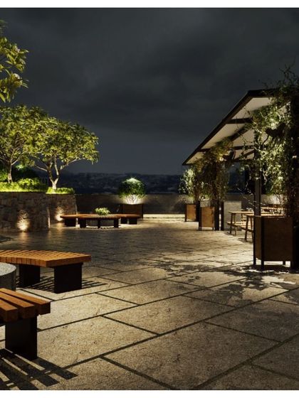 The lounge area on the Pay10 terrace features custom wooden benches and lush planters. This space provides a tranquil escape from the office, embodying our commitment to fostering a healthy work-life balance.