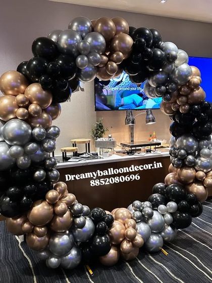 A sophisticated balloon ring in black, silver, and bronze. This color combination is perfect for corporate events, milestone birthdays, or any modern celebration.