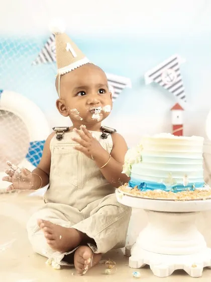 Enjoying every last bite. This sailor-themed cake smash was full of delicious fun and adorable, messy moments.
